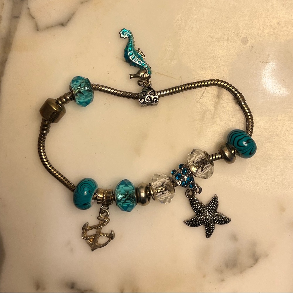 Silver Tone Sea Side Charm Bracelet with Blue Accents 8” length